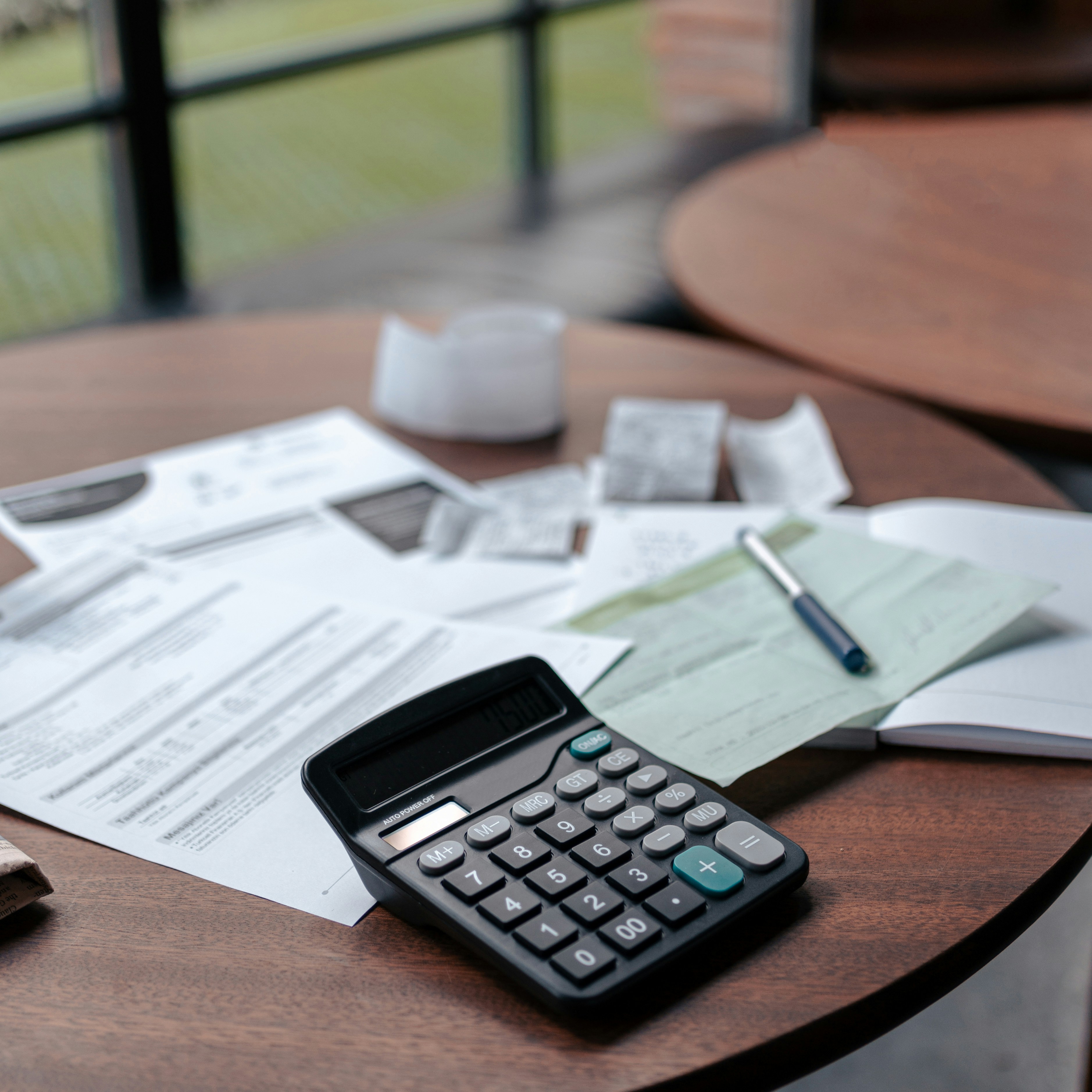 Calculator and financial documents on a desk