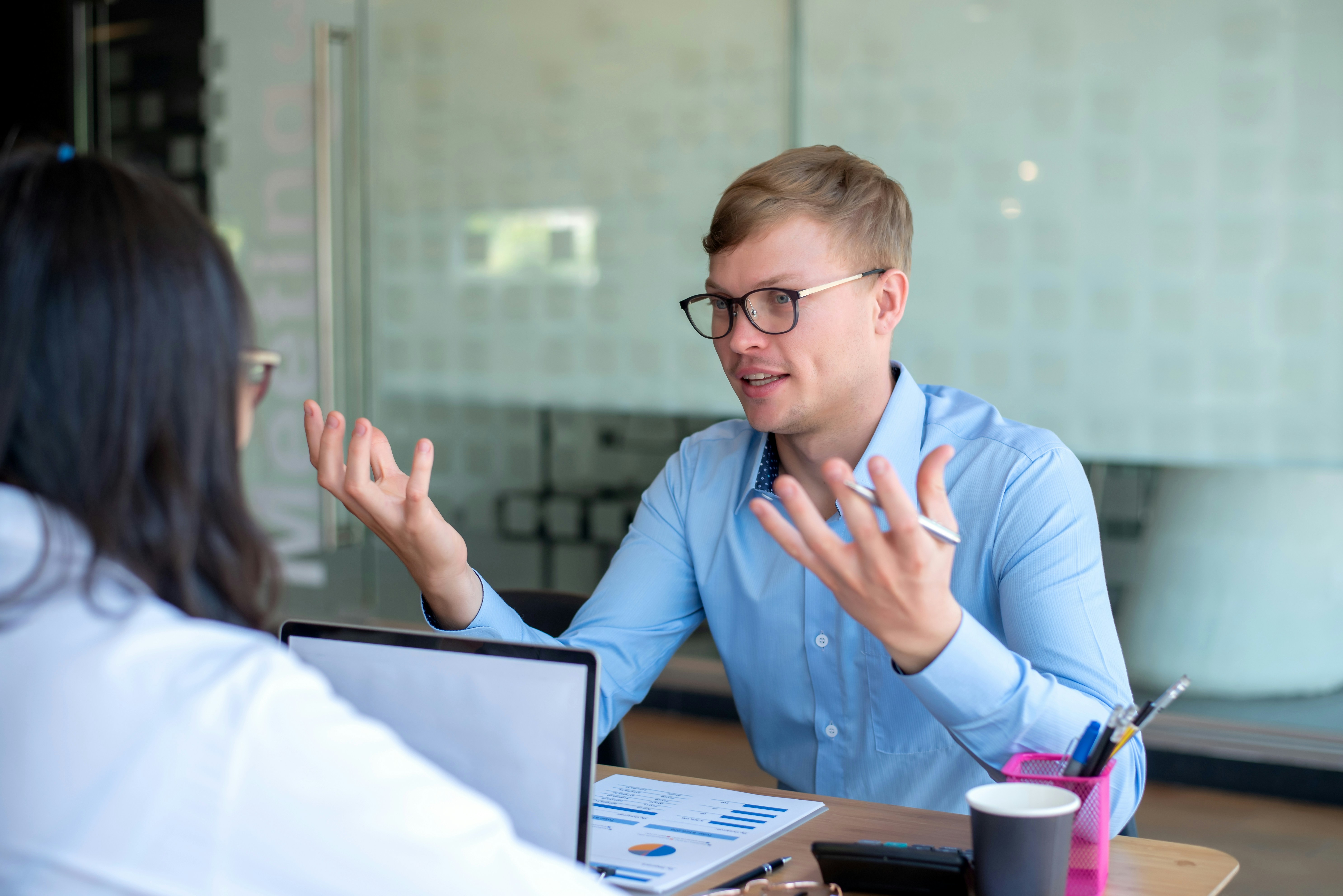 Consultant advising a nonprofit leader during a financial planning discussion